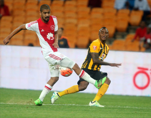 Kaizer Chiefs Tsepo Masilela with Ajax Cape Town Abbubaker Mobara during their ABSA/PSL match at FNB Stadium in Johannesburg. Picture credits: ANTONIO MUCHAVE/SOWETAN