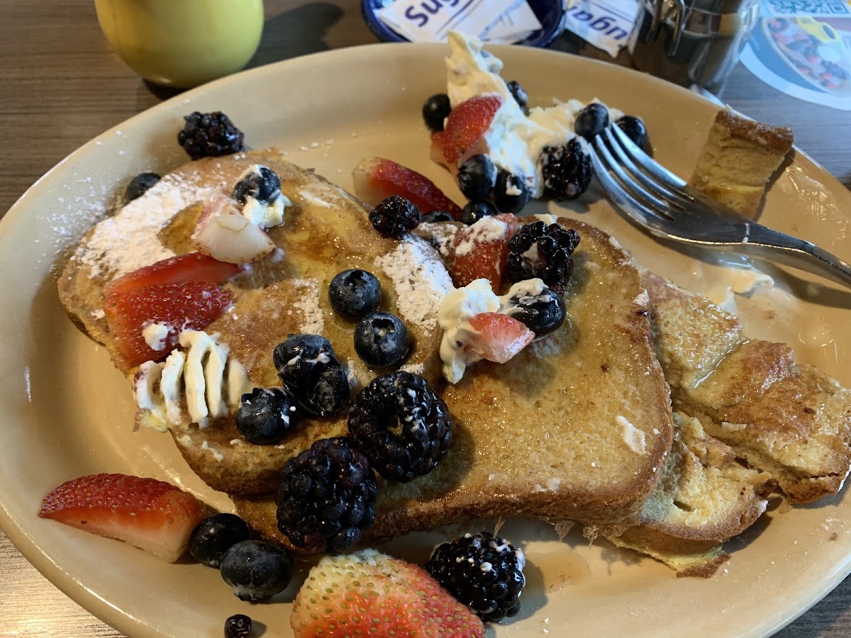 Gluten Free French Toast Neat. Pardon the half eaten slice, I was excited and forgot to take the picture first.  It was delicious.