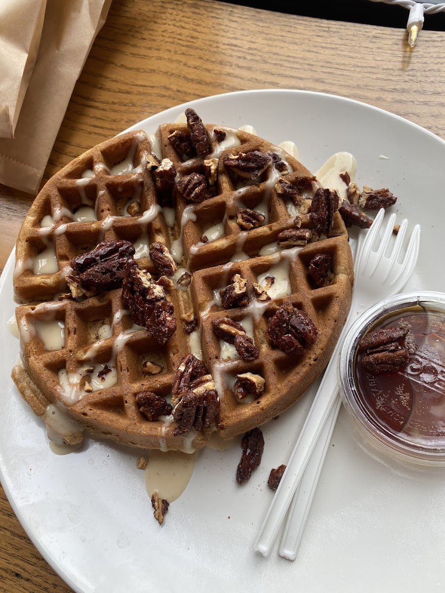 Special carrot cake waffle with candied pecans, glaze, and maple syrup.