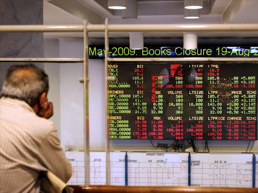 An investor looks at the digital board at the Nairobi Stock Exchange(NSE)/FILE