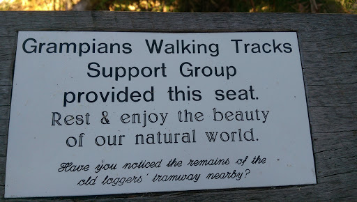 This plaque has been placed on the back of a park bench, on a walking track just outside Halls Gap.  You can only get to it by walking there! Plaque reads: Grampians Walking Tracks Support Group...