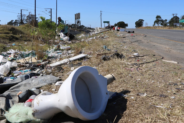 Waste including toilet seats were seen dumped outside the Berlin Roundhill dumpsite. Locals have raised concerns about the cows eating plastic waste.