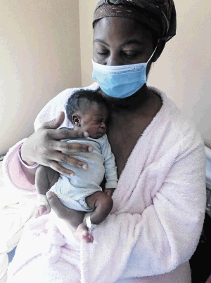 Nthabiseng Masenya and baby Boiketlo who has developed an unexplained infection on her ankle.
