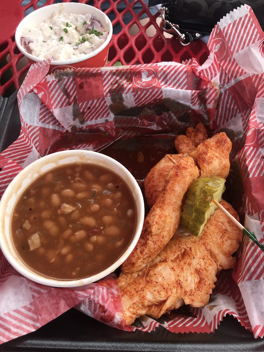 The grilled tender platter-medium spice with baked beans and potato salad. So good!