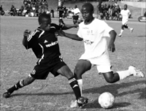 CLOSE CALL: Orlando Pirates' Phure Chochi fights for the ball eith SuperSport United's John Pitso during thier Engen Under -17 match at Marks Park at the weekend. Pic. Mohau Mofokeng. 13/07/2008. © Sowetan.