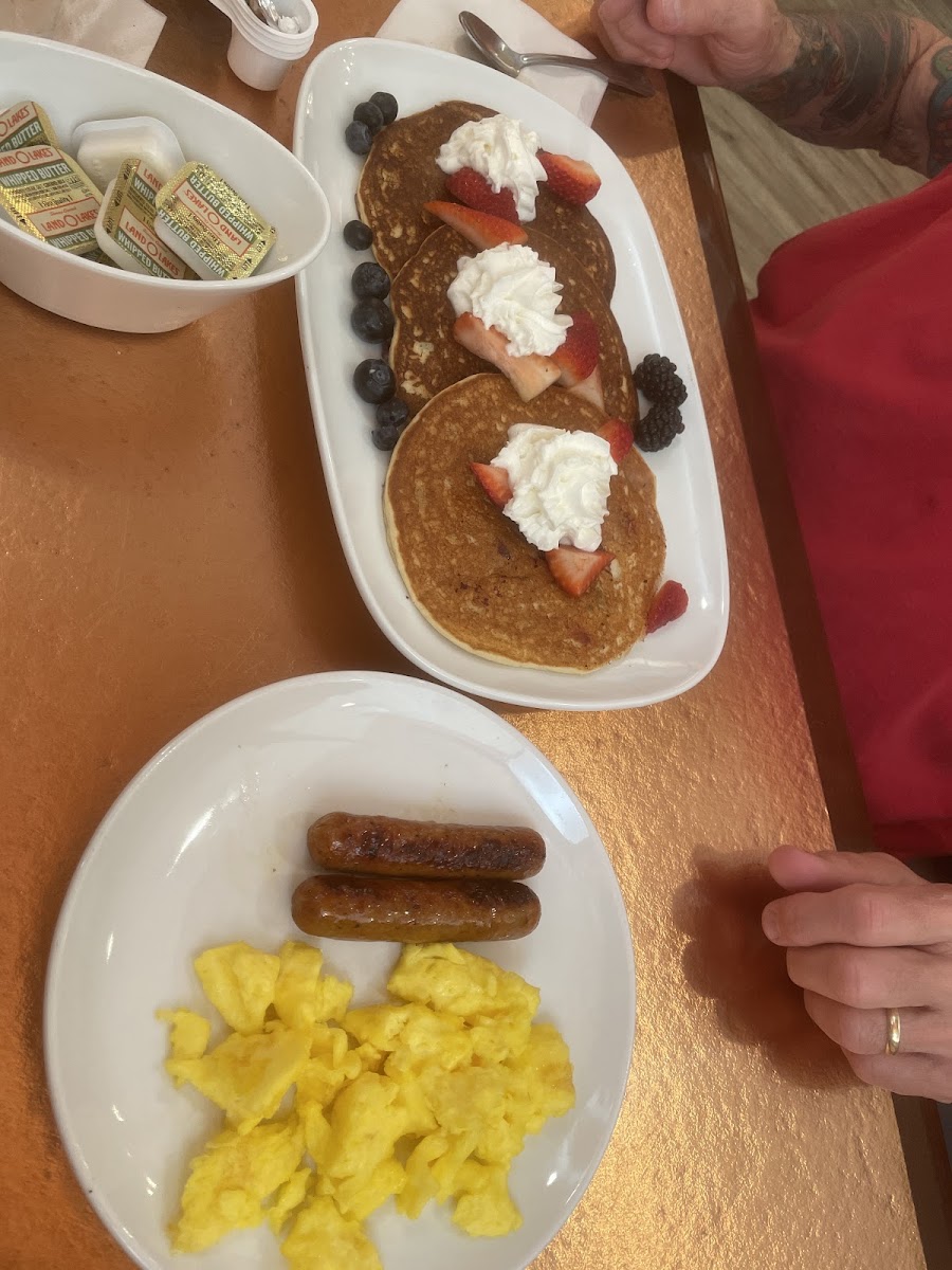 Triple berry pancakes, eggs, sausage.