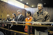 IN THE DOCK: (From right:) Harry Claasens, Tool Sriton, Marnus Steyl, Punpitak Chunchom and Chomlong Lemthongthai make an appearance in the Kempton Park Magistrate's Court on charges related to rhino poaching. File photo.