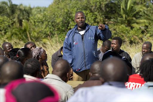 Sikhosiphi ‘Bazooka’ Radebe, chairman of the Amadiba Crisis Committee, speaking with members of the community in Xolobeni