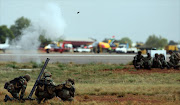 South African National Defence Force members fire a mortar round during a display for spectators at the Waterkloof Air Show in Pretoria. Pic: KEVIN SUTHERLAND. 22/09/2012. © Sunday Times