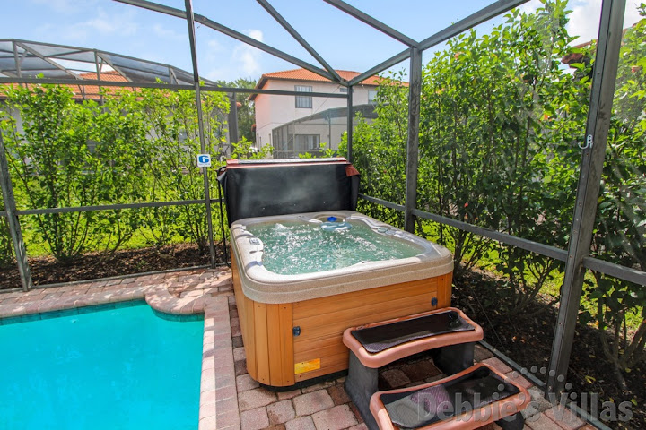 Spend time in the hot tub at this vacation villa in Orlando