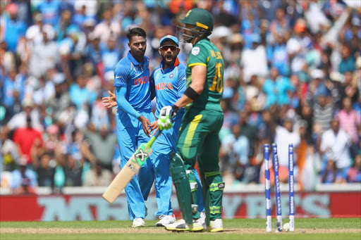 Hardik Pandya of India celebrates the wicket of Faf du Plessis of South Africa during the ICC Champions trophy cricket match between India and South Africa at The Oval in London on June 11, 2017 (Photo by Clive Rose/Getty Images)