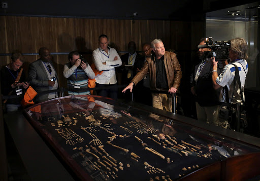 Professor Lee Berger (2nd R) gestures during an exhibit of the largest collection of fossils of close human relatives ever to go on public display in South Africa, at an area named "The Cradle of Humankind," northwest of Johannesburg, South Africa. REUTERS/Siphiwe Sibeko