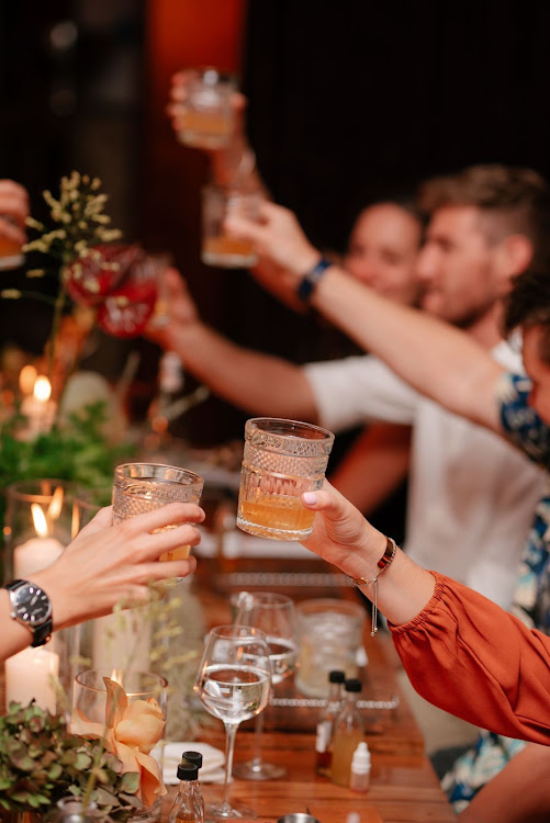 Guests raise at toast to the 'Bad Boy of Speyside' during the launch of Craigellachie at the Marabi Club in Maboneng, Johannesburg.