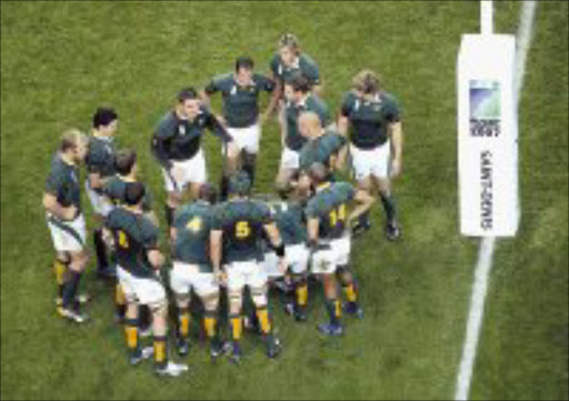 TEAM TALK: South African captain John Smit, centre left, rallies his teammates after an Argentina try during the Rugby World Cup semifinal between Argentina and South Africa, at the Stade de France Stadium in Saint Denis, near Paris, last Sunday. Pic. Matt Dunham. 14/10/07. © AP.