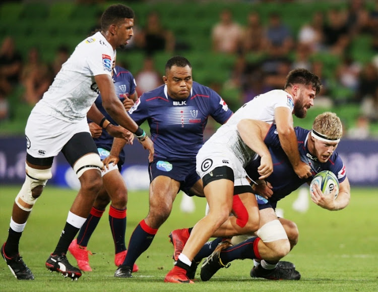 Matthew Philip of the Rebels gets tackled during the round six Super Rugby match between the Melbourne Rebels and the Sharks at AAMI Park on March 23, 2018 in Melbourne, Australia.