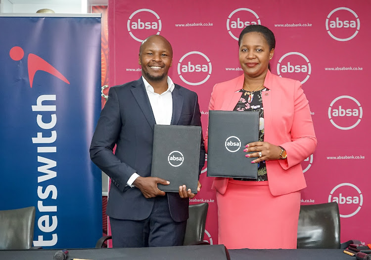 Interswitch head of sales network and marketing Daniel Kiriungi and Absa business banking director Elizabeth Wasunna during the partnership signing to provide SMEs with Online Tax Invoice Management System (TIMS) devices in Nairobi.