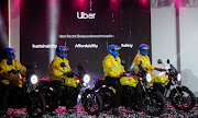 Uber boda boda riders pose for a picture at the launch of the company's first fleet of electric product in Nairobi, Kenya, August 31, 2023.