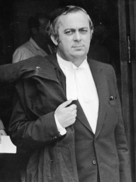 1960s. Portrait of a young George Bizos outside court, carrying his robes.