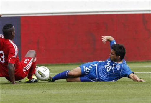 Andres Flores (R) of El Salvador fights for the ball with Yosmel De Armas of Cuba during their CONCACAF Olympic qualifying soccer match in Nashville, Tennessee March 24, 2012. Reuters/Harrison McClary