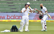 Dean Elgar of South Africa and Hashim Amla of South Africa at drinks during day 2 of the 2nd Sunfoil Test match between South Africa and Australia at St Georges Park on March 10, 2018 in Port Elizabeth.