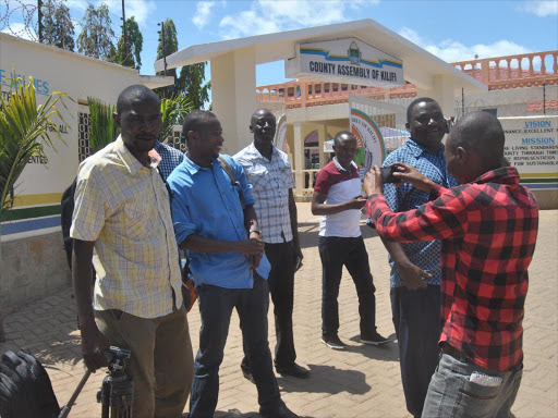 Journalists walk out of the Kilifi county assembly premises in Malindi after they were ordered out of a session on investigations into the Sh51 million scam, November 15, 2016. /ALPHONCE GARI