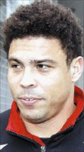 AC Milan's Ronaldo from Brazil arrives at the team's practice session for the Club World Cup soccer championship in Yokohama, near Tokyo, Tuesday, Dec. 11, 2007. AC Milan plays Japan's Urawa Reds in the semi-final on Dec. 13. (AP Photo/Shizuo Kambayashi)