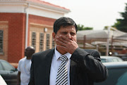Billionaire publisher Atul Gupta outside the Randburg Magistrate's court in Johannesburg, South Africa on 27 September 2010. Gupta was charged with obstruction of justice and arrested on 25 September 2010, however the case was dropped due to lack of evidence. Gupta was also allegedly subjected to xenophobic behaviour from the police. (Photo by Gallo Images/The Times/Puxley Makgatho)