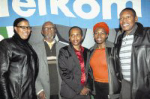 EXCITED: NSL Telkom Charity Trust chairman Leepile Taunyane, and Telkom sponsorship manager Zola Nkuta, are flanked by, from right, North West director of communications and marketing Shirley Montsho, North West 2010 unit's Sylvia Mokaila and Mmabatho Stadium manager George Seate at the launch of the Charity Cup launch in Johannesburg yesterday. Pic. Antonio Muchave. 18/06/08. © Sowetan.