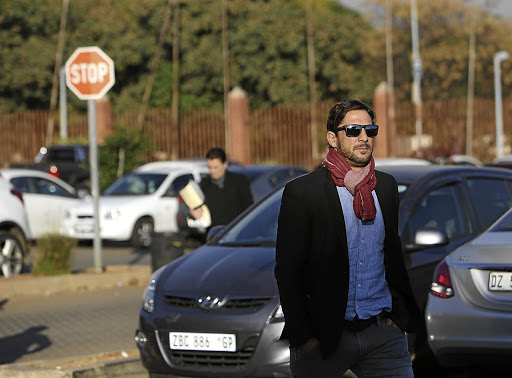 Adam Catzavelos arriving at the Randburg magistrate's court on Tuesday over his racist rant.A video of the incident, in which he uses the k-word, went viral last year. /ALON SKUY