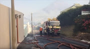 A house in Simon’s Town was “well alight” at 5pm on Wednesday after hundreds of southern peninsula residents were told to flee a wildfire.