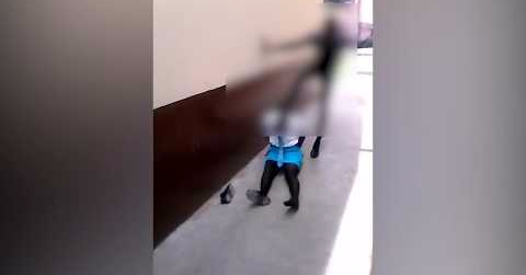 A shocking cellphone video shows a man hitting a girl dressed in school uniform.
