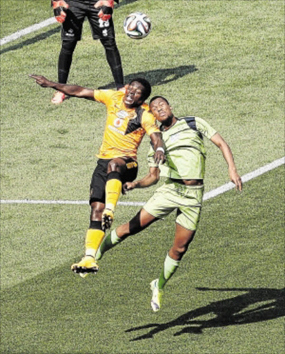 HEADING OUT : Kaizer Chiefs striker Kingston Nkhatha, left, fights for the ball with Platinum Stars' Tshepo Gumede during their Telkom Knockout quarterfinal match at FNB Stadium yesterday Photo: Veli Nhlapo