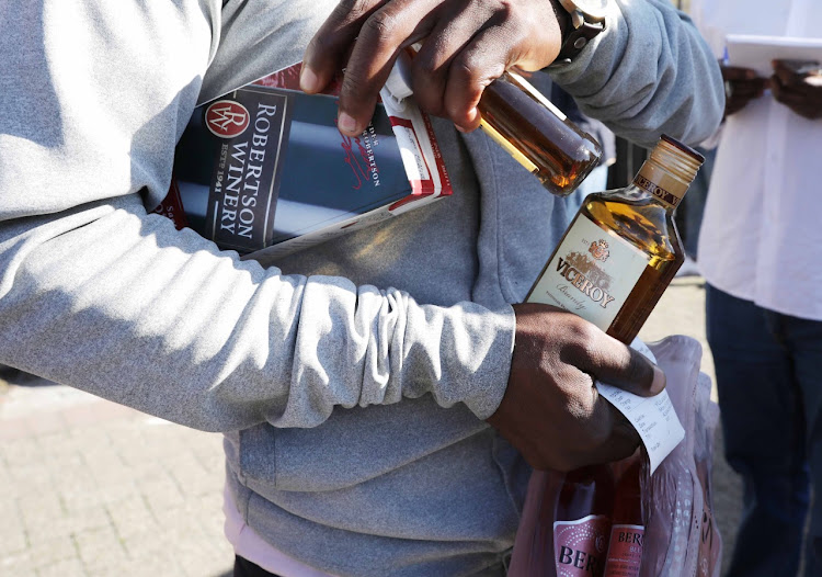 Customers arrived before dawn at some liquor stores to ensure they got what they came for.