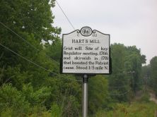 Grist mill. Site of key Regulator meeting, 1766, and skirmish in 1781 that boosted the Patriot cause. Stood 1/5 mile N.Plaque via North Carolina Highway Historical Marker Program, and is used with...