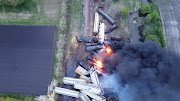 Fire is seen on a Union Pacific train carrying hazardous material that has derailed in Sibley, Iowa, U.S., in this still frame obtained from social media drone video dated May 16, 2021.