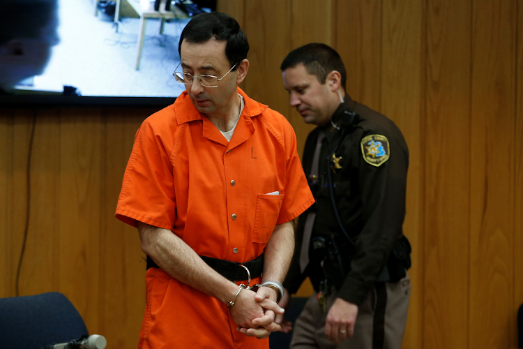 Larry Nassar, a former team USA Gymnastics doctor who pleaded guilty in November 2017 to sexual assault charges, stands in court during his sentencing hearing in the Eaton County Court in Charlotte, Michigan, US.