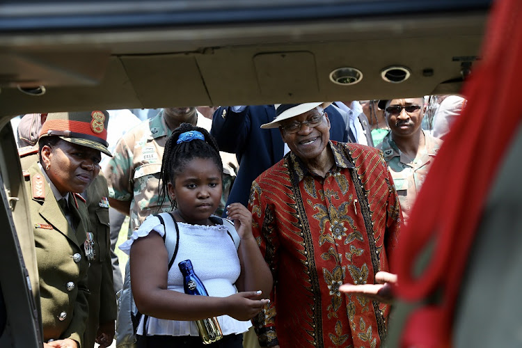 December 29, 2017 President Jacob Zuma and his daughter Nqobile inspect a military helicopter on display in Nkandla for career day . He was also hosting a Christmas party for children in his home town.