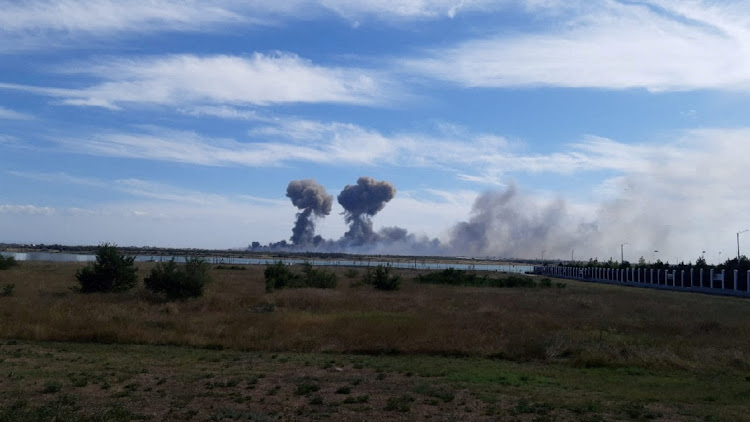 Smoke rises after explosions were heard from the direction of a Russian military airbase in Crimea, in this still image obtained by Reuters, August 9 2022. Picture: RUETERS