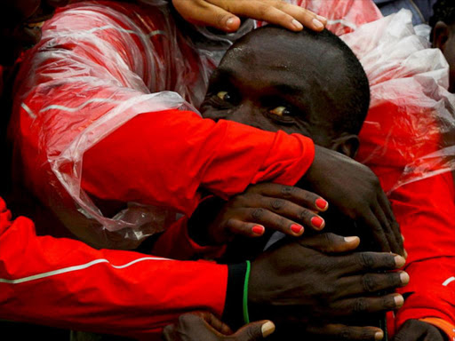 Eliud Kipchoge, Kenya's 42km Olympic marathon gold medal winner, celebrates with supporters. /REUTERS