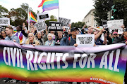 LGBTQ activists and supporters block the street outside the US Supreme Court as it hears arguments in a major LGBT rights case on whether a federal anti-discrimination law that prohibits workplace discrimination on the basis of sex covers gay and transgender employees in Washington, U.S. October 8, 2019. 