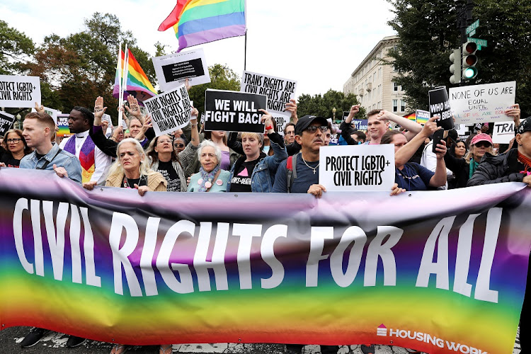 LGBTQ activists and supporters block the street outside the US Supreme Court as it hears arguments in a major LGBT rights case on whether a federal anti-discrimination law that prohibits workplace discrimination on the basis of sex covers gay and transgender employees in Washington, U.S. October 8, 2019.