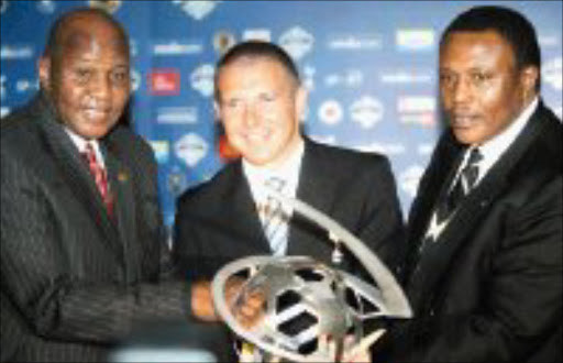 REVENGE: Kaizer Chiefs boss Kaizer Motaung, left, Tottenham Hotspur's chief executive Barber Paul and Orlando Pirates' chairman Dr Irvin Khoza at the vodacom Challenge Cup launch yesterday. Pic. Antonio Muchave. 05/06/07. © Sowetan.