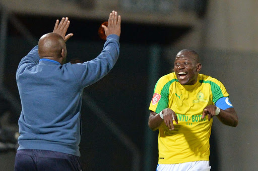 Mamelodi Sundowns captain Hlompho Kekana celebrates with his head coach Pitso Mosimane during the Absa Premiership match against city rivals SuperSport United at Lucas Moripe Stadium on April 19, 2017 in Pretoria, South Africa. Sundowns won 0-1.