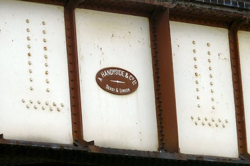 This small plaque on the viaduct carrying the railway lines into Manchester over Chapelfield Road SJ8597 : Chapelfield Road shows it be the work of Andrew Handyside, whose iron foundry output...