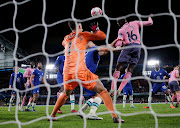 Everton's Abdoulaye Doucoure scores their first goal past Chelsea's Kepa Arrizabalaga in the Premier League match at Stamford Bridge in London on March 18 2023.