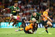 Springboks player Willie le Roux is brought to ground in the Rugby Championship match against the Wallabies at Suncorp Stadium  in Brisbane on September 18 2021.