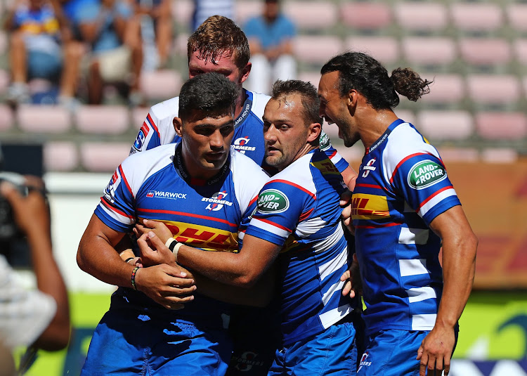 Damian de Allende of the Stormers (l) celebrates scoring a try with teammates during the Super Rugby match against the Jaguares at Newlands Stadium, Cape Town on 17 February 2018.