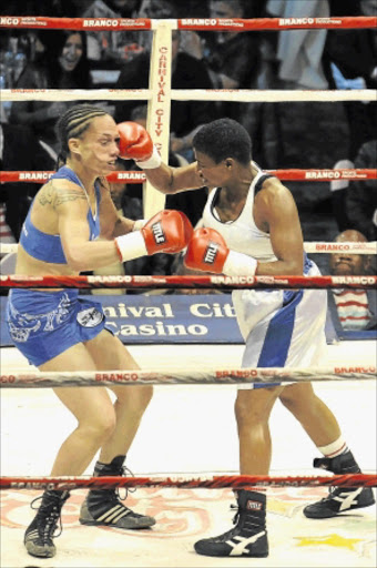 BACK ON TRACK: Noni Tenge, right, seen here against Daniella Smith, will fight for the WBA Interim welterweight title Photo: Gallo Images