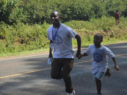 Gabriel Nderitu who is the manager of New Life Home Trust participating in a 6Km charity walk on Sunday in Nyeri town.