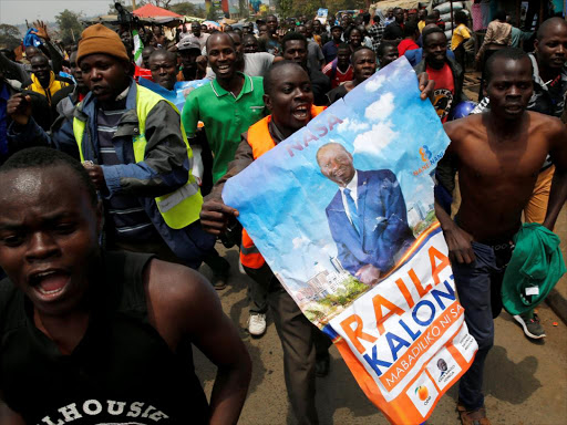 Supporters of opposition leader Raila Odinga celebrate in Kibera slum after President Uhuru Kenyatta's election win was declared invalid by a court in Nairobi, Kenya, September 1, 2017. /REUTERS